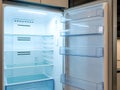 Modern refrigerator interior shines with empty shelves Royalty Free Stock Photo