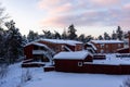 Modern residence. Traditional houses of red color on winter morning sunrise. Royalty Free Stock Photo