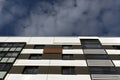 Modern residential building against cloudy sky. Royalty Free Stock Photo