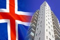 Modern residential building on background of flag Iceland