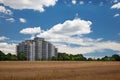 Modern residential high rise building in the middle of grain fie