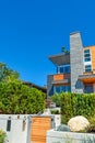 Modern residential house with concrete terrace and wooden gate