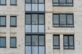 Modern residential multi-storey building. Windows and balconies on a new residential building close-up. Buying and selling Royalty Free Stock Photo