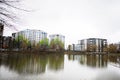 Modern residential multistory apartment buildings near lake. Facade of new houses Royalty Free Stock Photo