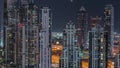 Modern residential and office complex with many towers aerial night timelapse at Business Bay, Dubai, UAE. Royalty Free Stock Photo