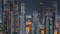 Modern residential and office complex with many towers aerial night timelapse at Business Bay, Dubai, UAE. Royalty Free Stock Photo