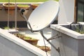 Modern residential satellite dish antenna view with selective focus under daylight. Royalty Free Stock Photo