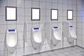 Modern restroom interior with urinal row Royalty Free Stock Photo