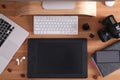 Modern retoucher`s workplace with digital devices on wooden table, flat lay