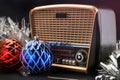 Radio receiver in retro style with christmas decorations on black background Royalty Free Stock Photo