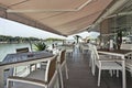 Modern riverside cafe terrace in the morning Royalty Free Stock Photo