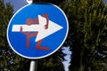 Modern road sign with drawing by Clet Abraham in Florence, Italy