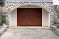 Modern roll up metal garage door with faux wood grain finish