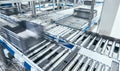 Modern roller conveyor system with boxes in motion Royalty Free Stock Photo