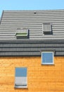 Modern roof with attic skylights windows and roof ventilation system.