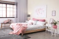 Modern room interior with comfortable double bed Royalty Free Stock Photo