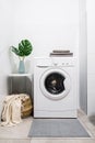 Modern room interior design with washing machine and decor Royalty Free Stock Photo