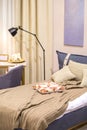 A modern room for a teenager in the Scandinavian style - a bed, a desk, an armchair, curtains, a contemporary bedroom and workplac Royalty Free Stock Photo