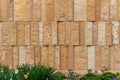 Modern rough textured limestone wall background with vertical aligned stone bricks