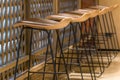 Modern row of black steel frame wooden chair and wooden counter ininterior for coffee shop and restuarant achitecture decoration Royalty Free Stock Photo