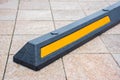 Modern rubber barrier for cars in summer parking in the street Royalty Free Stock Photo