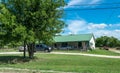 Modern rural life in Texas. Ancient wooden house and lawn in front the garden Royalty Free Stock Photo