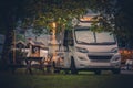 Modern RV Camper Van and a Camping Spot Royalty Free Stock Photo