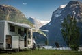 Modern RV Recreational Vehicle Parked in Front of Scenic Landscape
