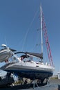 Modern sailboat yachts moored stored up in dry storage waiting for maintenance