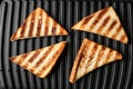 Modern sandwich maker with bread slices, top view Royalty Free Stock Photo