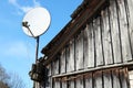 A modern satellite dish is fixed on the roof Royalty Free Stock Photo