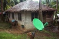 Modern satellite dish next to the shack among the palm trees. Phillipines
