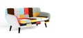 Modern scandinavian bright sofa of colorful cloth scraps, patchwork. Sofa with wooden black legs on isolated white