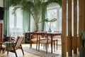 Modern scandinavian home interior of living room with design retro furniture, tropical plant, window, decoration