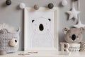 The modern scandinavian newborn baby room with mock up frame, wooden toy, plush toys, decor, children accessories.