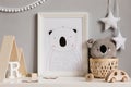 The modern scandinavian newborn baby room with mock up frame, wooden car, plush toys, children accessories, stars.