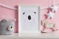 The modern scandinavian newborn baby room with mock up frame, wooden toy, plush toys, decor, children accessories.