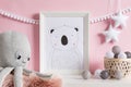 The modern scandinavian newborn baby room with mock up frame, wooden toy, plush toys, decor, children accessories.