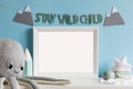 The modern scandinavian newborn baby room with mock up frame, wooden toys, plush animals, children accessories.