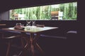 Modern scandinavian farmhouse contemporary rustic restaurant interior with wine glasses, selective focus