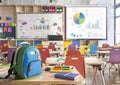 Modern school classroom with a brightly colored backpack of a schoolboy Royalty Free Stock Photo