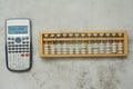 Modern scientific calculator with abacus Royalty Free Stock Photo