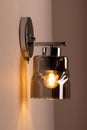 Modern sconce lamp on wall in bedroom Royalty Free Stock Photo
