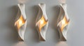 Modern sculptural wall lights with warm illumination. Artistic interior lighting design