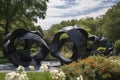 modern sculpture garden featuring sleek and abstract sculptures among blooming flowers