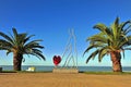 Modern sculpture with a heart on the beach