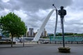 Modern sculpture, the Millennium Bridge and Baltic Centre for Contemporary Art landmarks at Newcastle Quayside Royalty Free Stock Photo