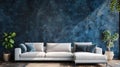 Modern Sectional Sofa Against a Blue Concrete Wall Royalty Free Stock Photo