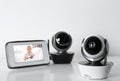 Modern security CCTV cameras and monitor with baby`s image