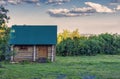 A modern semi-antique building made from solid trunks of trees